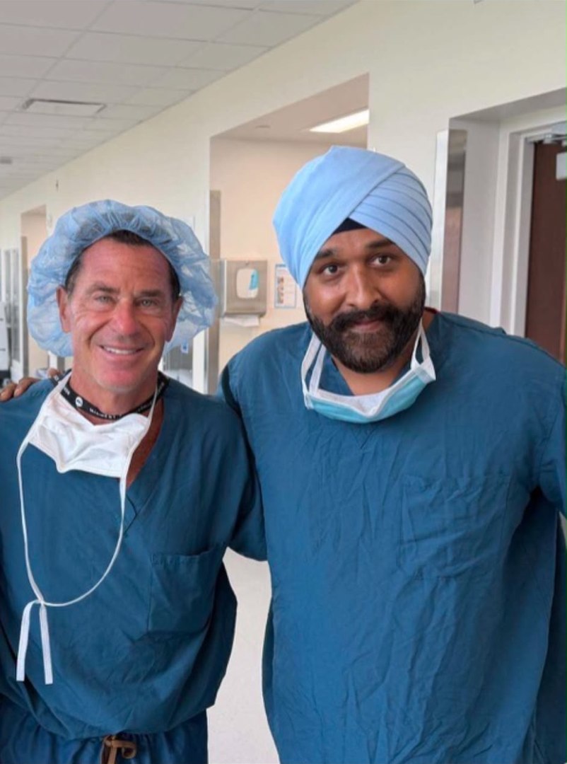 Professor Brian Cole and Mr Navjot Bhangoo in surgical scrubs during the US travelling fellowship